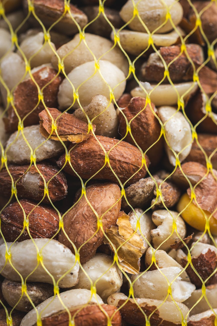 Person packing healthy travel snacks like nuts, protein bars, and fruit into a carry-on bag before a trip